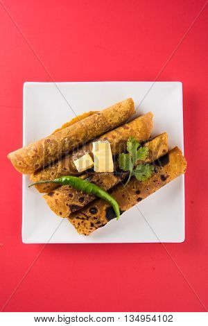 Hot delicious paratha with ghee, green chilly, coriander and tomato sauce. Paratha Rolls. Chapati made using indian spices. Kolkata rolls