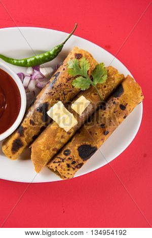 Hot delicious paratha with ghee, green chilly, coriander and tomato sauce. Paratha Rolls. Chapati made using indian spices. Kolkata rolls