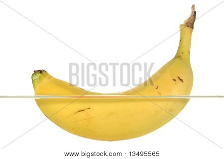 A banana swims in water