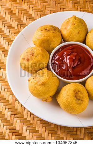 indian snacks also known as urad daal vada or indian pakoda or couth indian pakora or batata vada or aalu bonda or aalu bonde