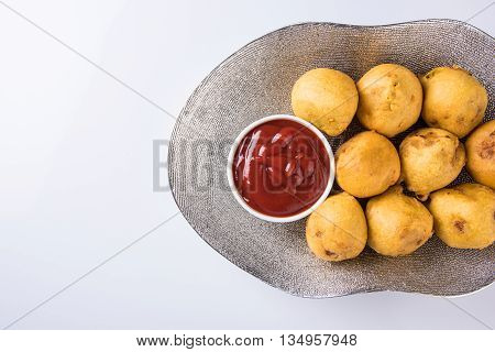 indian snacks also known as urad daal vada or indian pakoda or couth indian pakora or batata vada or aalu bonda or aalu bonde