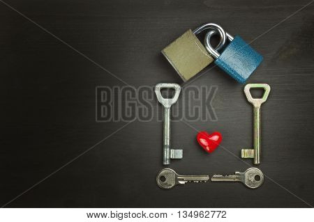 Locks and keys on a wooden table. New Symbol of love and happiness. Lock and heart. Key to the heart. Locked love. Harmony of souls.
