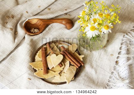 Plate of homemade cookies and cinnamon. Cookies handmade. Dry diet cookies, healthy lifestyle.