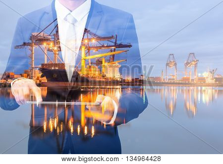 Double Exposure Of Businessman Hand Hold Tablet