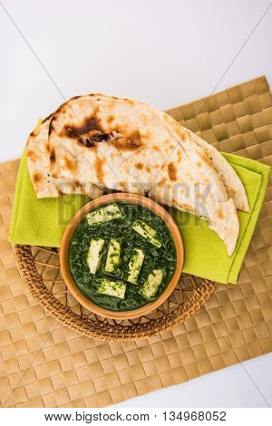 tasty palak paneer served with nan / naan / roti / chapati / fulka / tandoori naan / indian bread