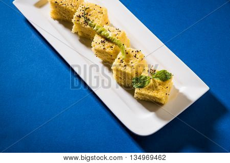 Gujrati famous snack made up of gram flour, semolina called khaman Dhokla
