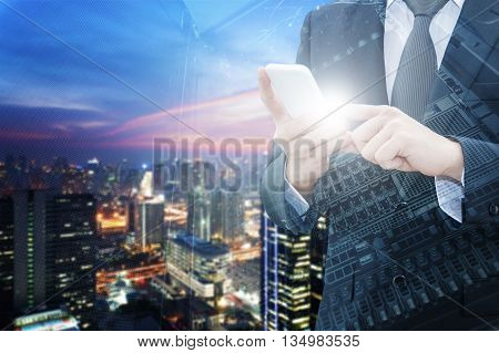 Double exposure of professional businessman using smart phone with servers technology in data center city center of business and world map network connection in IT Business concept world map from NASA