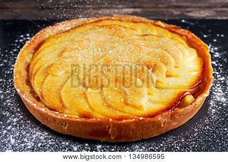Golden Bramley apple tart with cinnamon glaze.