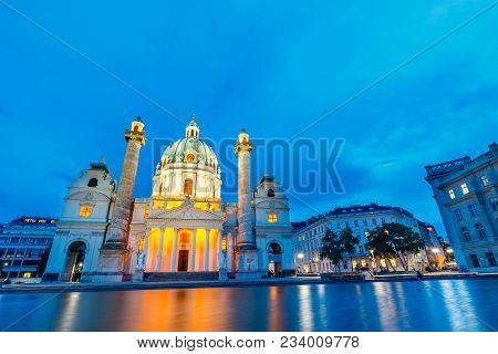 Night View Of Famous Saint Charles's Church At Karlsplatz In Vienna, Austria