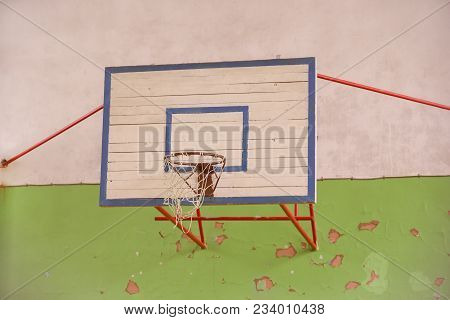 Basketball  Hoop  At  A  Backyard.  Holl. Old.