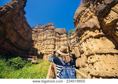 Young Asian Woman Traveler Travelling To Wonderful Soil Cliff Pha Cho At Mae Wang National Park, Doi
