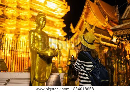 Young Woman Traveler Traveling To Wat Phra That Doi Suthep Temple. This Temple Contains Supreme Exam