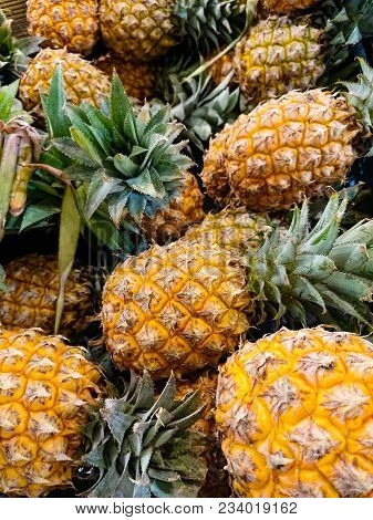 Pineapples For Sale At The Fruit Market.pineapple In A Box For Sale On The Market.pineapple Sweet An