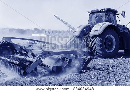 Agriculture. The Tractor Prepares The Ground For Sowing And Cultivation. Agronomy, The Concept Of Fa