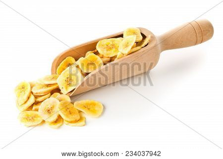 Heap Of Dried Banana Chips Snack In Wooden Scoop Or Spoon Over White Background