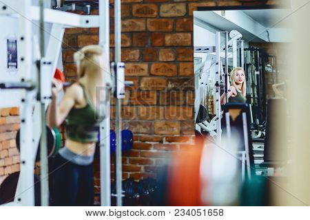 Girl Is Doing Squats In Simulator