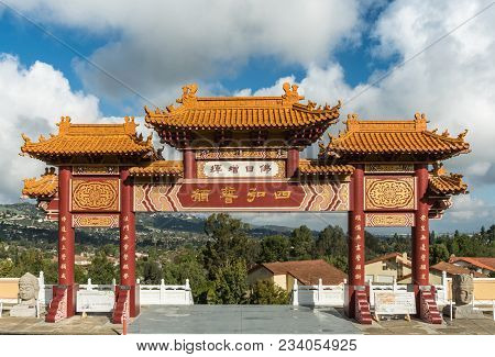 Hacienda Heights, Ca, Usa - March 23, 2018: Red And Ochre Colored Torii Enrance Gate To Hsi Lai Budd