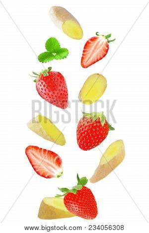 Isolated Flying Fruits. Isolated Falling Strawberry And Ginger On White Background With Clipping Pat
