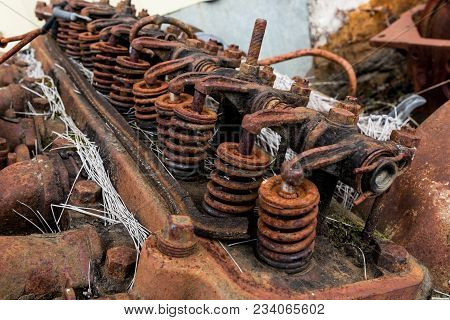 Vintage Antique Automotive Cylinder Head Rocker Shaft, Arms, And Springs Covered In Grass, Rust And 