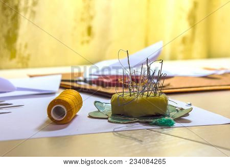 Threads, Needles On The Table. A Sewing Workshop.