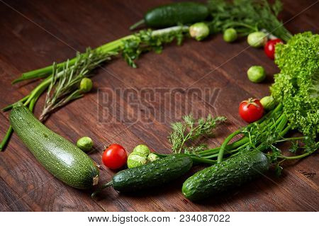 The Round Frame Made Of Vegetables And Herbs On A White Textured Background, Copy Space, Top View, C
