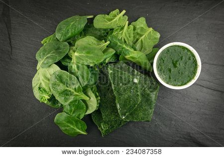 Fresh Baby Spinach Leaves And Frozen Spinach. Unfrozen Spinacia Oleracea In White Bowl. Leafy Green 