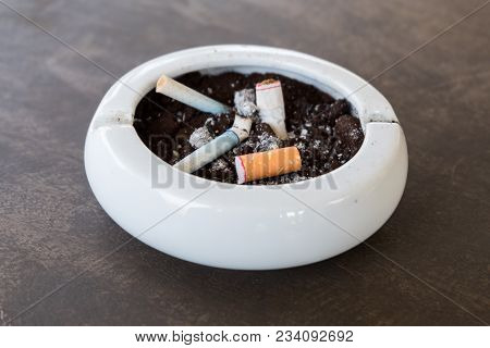 Burnt Cigarette Butts And Ashes.