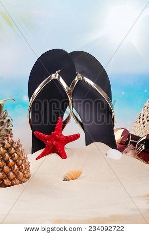 Flip Flops, Hat, Mini Pineapple And Sunglesses On Sandy Beach. Travel, Vacation, Holidays Background
