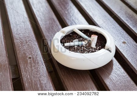 Burnt Cigarette Butts And Ashes.