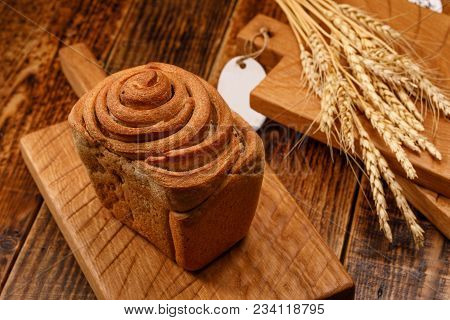 Still Life With Fresh Delicious Garlic Bread And Spikelets. Beautiful Homemade Bread On A Textured W