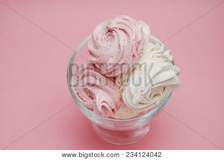 Close Up Pink Homemade Strawberry Marshmallows Or Zephyr. Pink Desert Over Pink Background