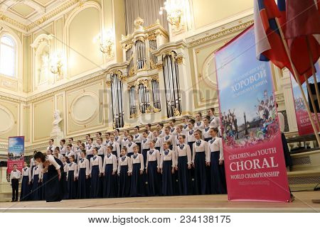 SAINT-PETERSBURG, RUSSIA - FEBRUARY 25, 2018: Choir Kapel, Russia performs during V Children and Youth World Choral Championship. First championship was held in Hong Kong in 2011