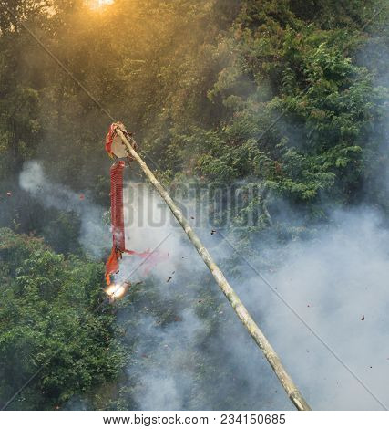 China Red Cracker Line Hanging On Bamboo Stick Are Fired And Continue To Explode