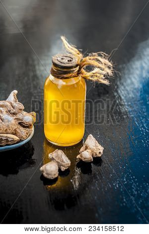 Close Up Of Ayurvedic Herb Or Folk Medicine Dried Ginger Or Zingiber Officinale With Common Cooking