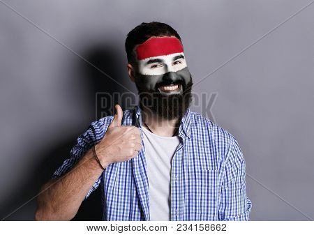 Portrait Of Man With The Flag Of Egypt Painted On His Face. Football Or Soccer Team Fan, Sport Event