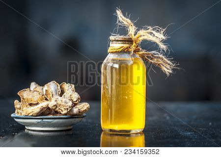 Close Up Of Ayurvedic Herb Or Folk Medicine Dried Ginger Or Zingiber Officinale With Common Cooking