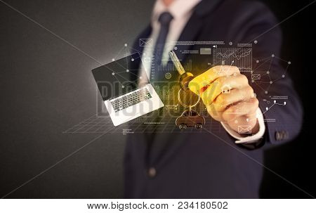 Businessman in suit holding keys with statistics, graphs and icons around
