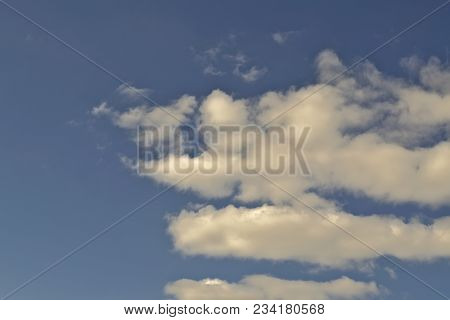 Blue April Sky With Light White Clouds Natural Background
