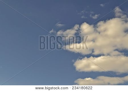 Blue April Sky With Light White Clouds Natural Background