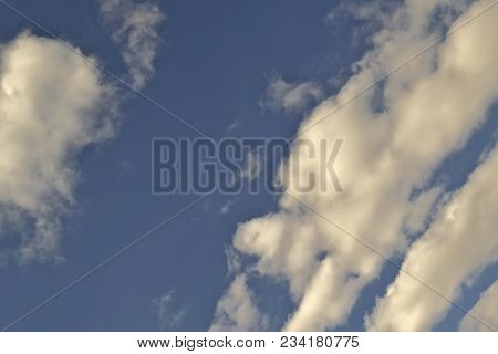 Blue April Sky With Light White Clouds Natural Background