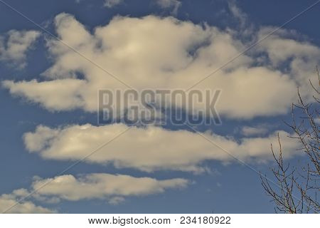 Blue April Sky With Light White Clouds Natural Background