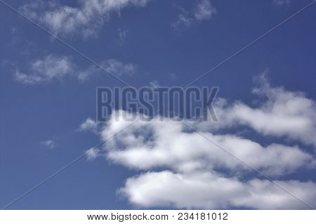 Blue April Sky With Light White Clouds Natural Background
