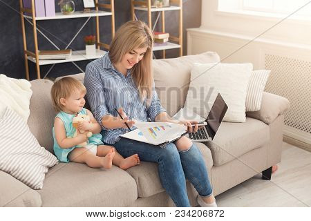 Happy Beautiful Business Mom Working With Documents In Home Office While Her Cute Baby Playing With 