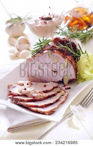Roast Ham Stuffed With Garlic With Tuna Sauce.