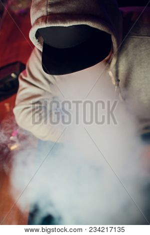 Portrait Of Young Man Smoking An Hookah