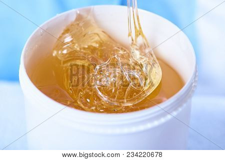 A Pack Of Stretchy Golden Luminous Sugaring Paste, Close-up