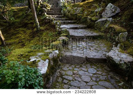 Stone Stairwave In Path With Green Grass And Moss In Temple