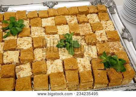 A Lot Of Pieces Of Fresh Honey Cakes, On A Iron Tray. Event Catering Service, Top View