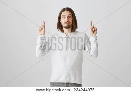 What Shame To Lose Such Chance. Portrait Of Confused Questioned Young Guy With Beard Raising Hands A