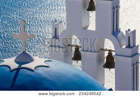The Three bells of Fira and blue dome, Santorini, Greece, Europe.